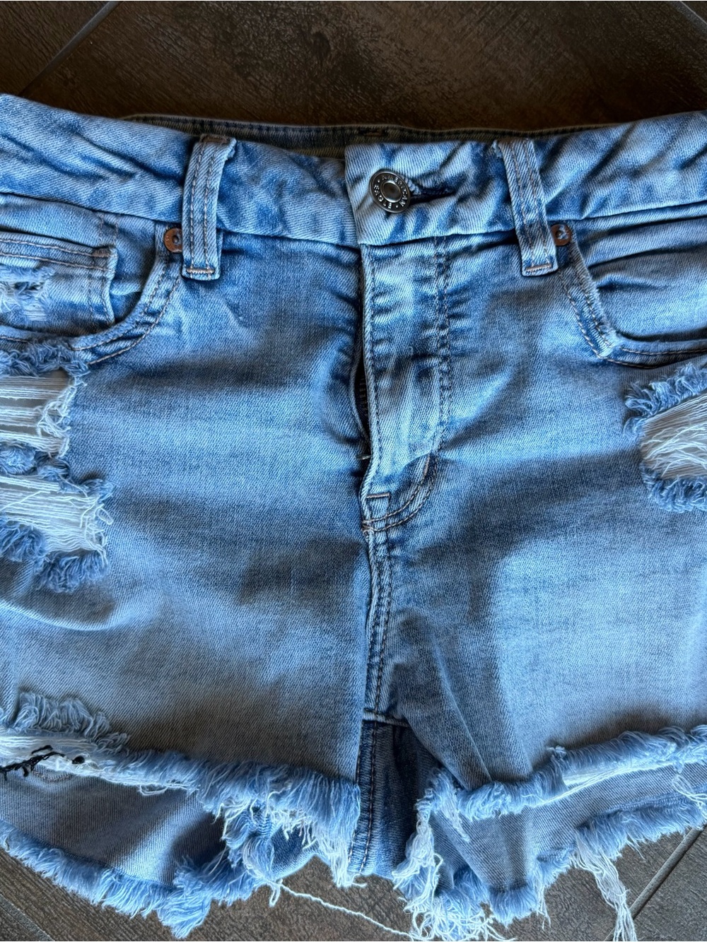 Women’s Distressed Light Blue Denim Shorts. next level stretch